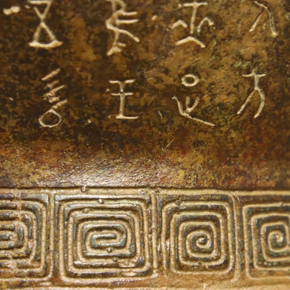 A bronze human face corner cup - 5