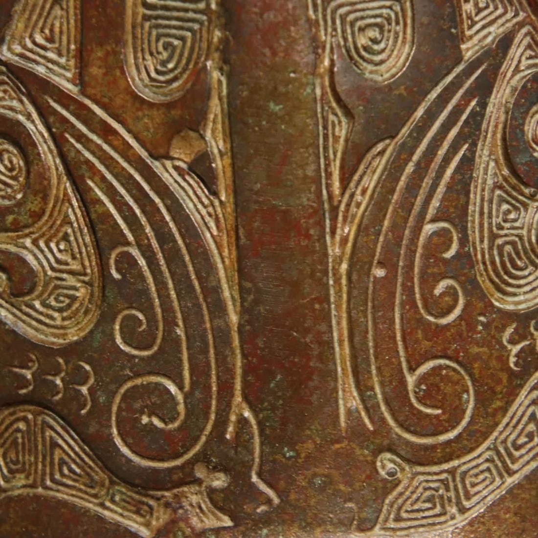 A bronze human face corner cup - 6