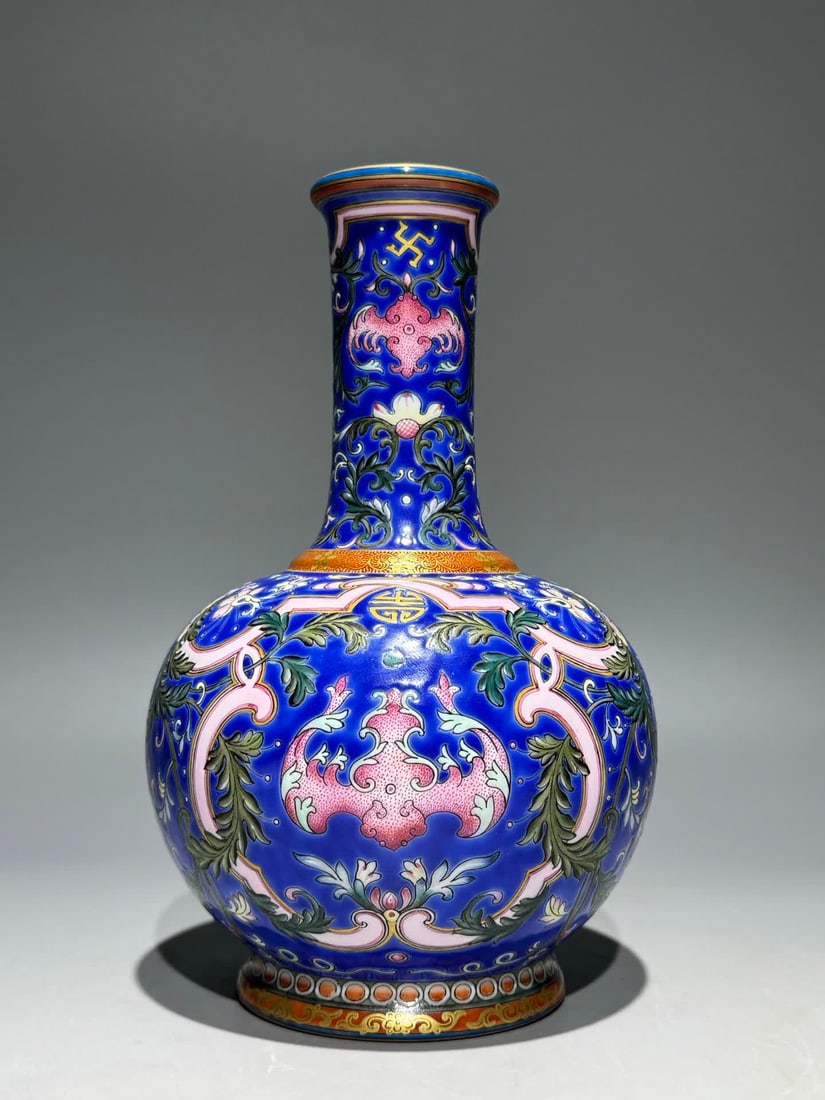 A Qianlong enamel colored blue ground Fushou Liantian ball bottle: Qianlong year enamel colorful blue ground Fushou Liantian ball bottle SIZE: H: 19cm Belly D: 12cm (The Dimensions Of All Batches Are Manually Measured.If You Need More Detailed Information, Please Con