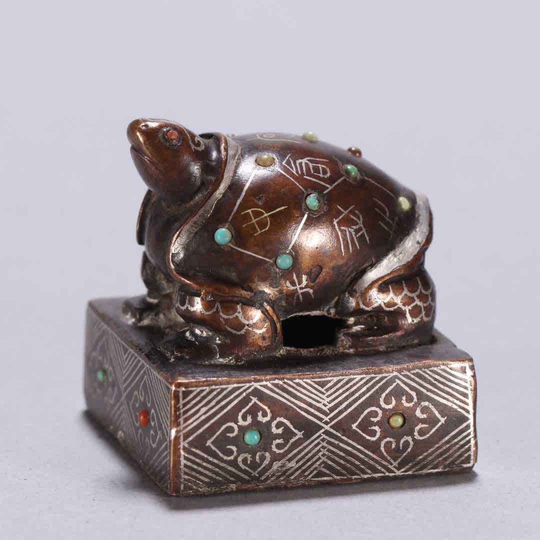 A copper gold and silver turtle button seal - 2