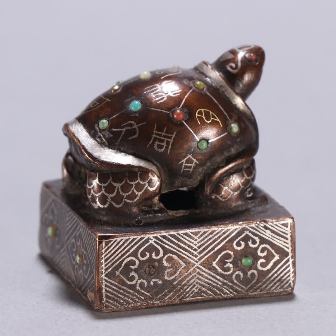 A copper gold and silver turtle button seal - 5