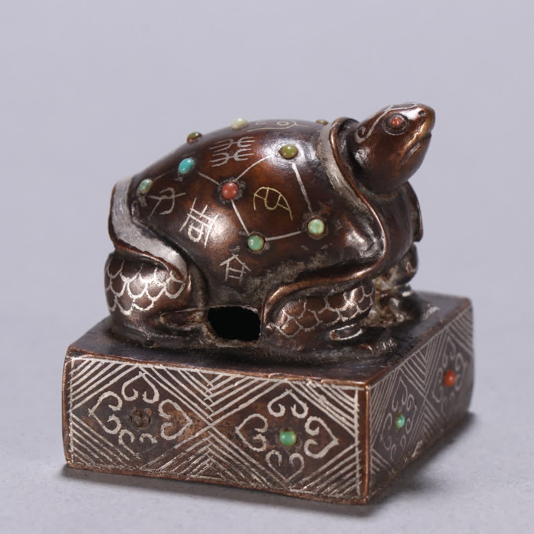 A copper gold and silver turtle button seal - 6
