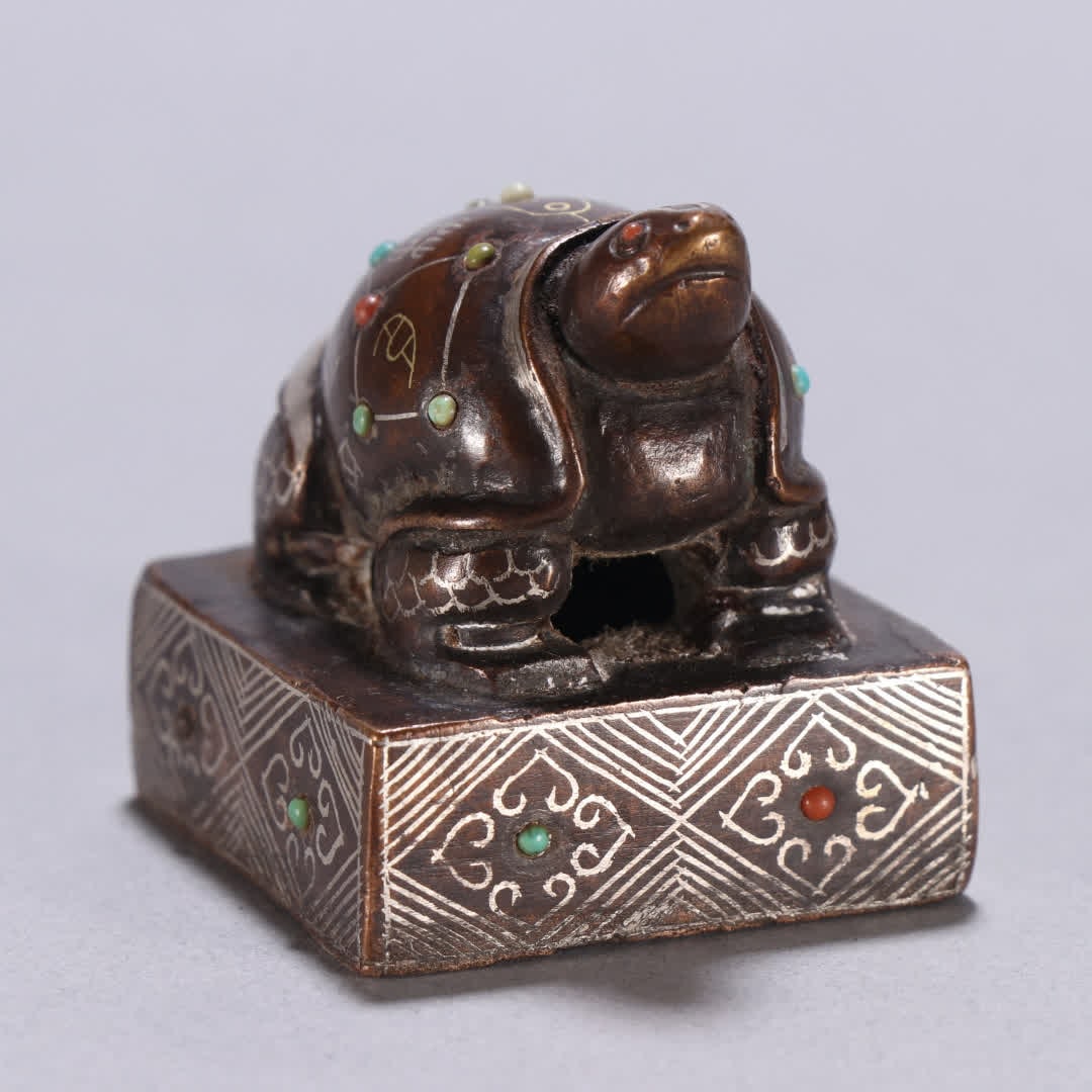 A copper gold and silver turtle button seal - 7