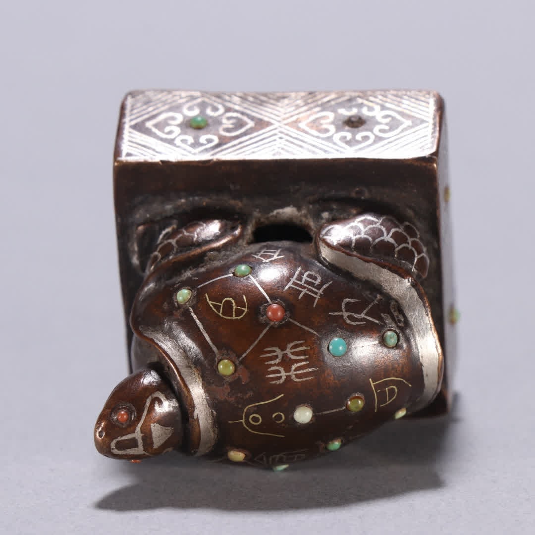 A copper gold and silver turtle button seal - 8