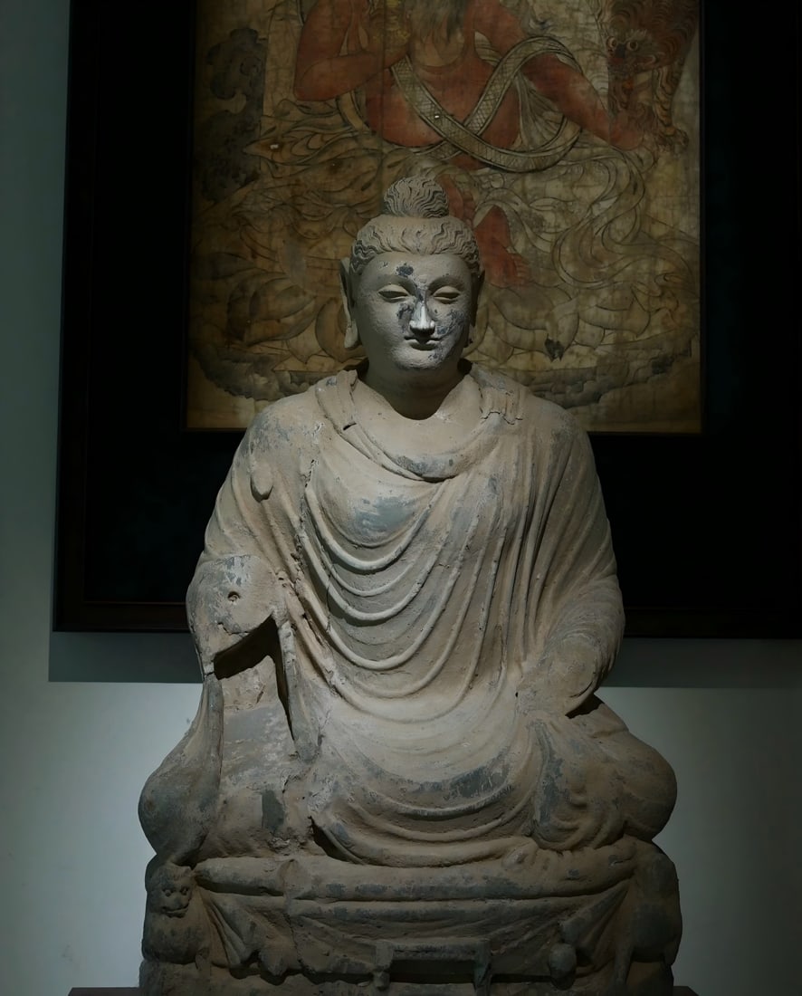 A Gandhara Buddha statue from the 2nd to 5th centuries AD has had its face and nose repaired (1 of 8)