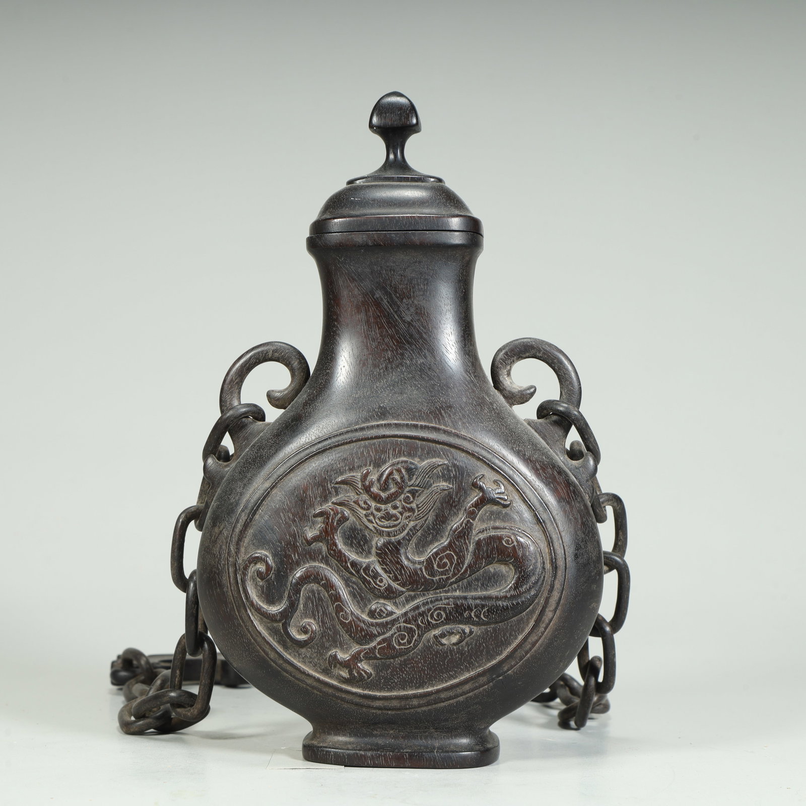 A Qing Dynasty rosewood relief dragon pattern chain flat bottle: Qing Dynasty rosewood relief dragon pattern chain flat bottle SIZE: H:18cm L:11cm W:5cm W:352g (The Dimensions Of All Batches Are Manually Measured.If You Need More Detailed Information, Please Contac