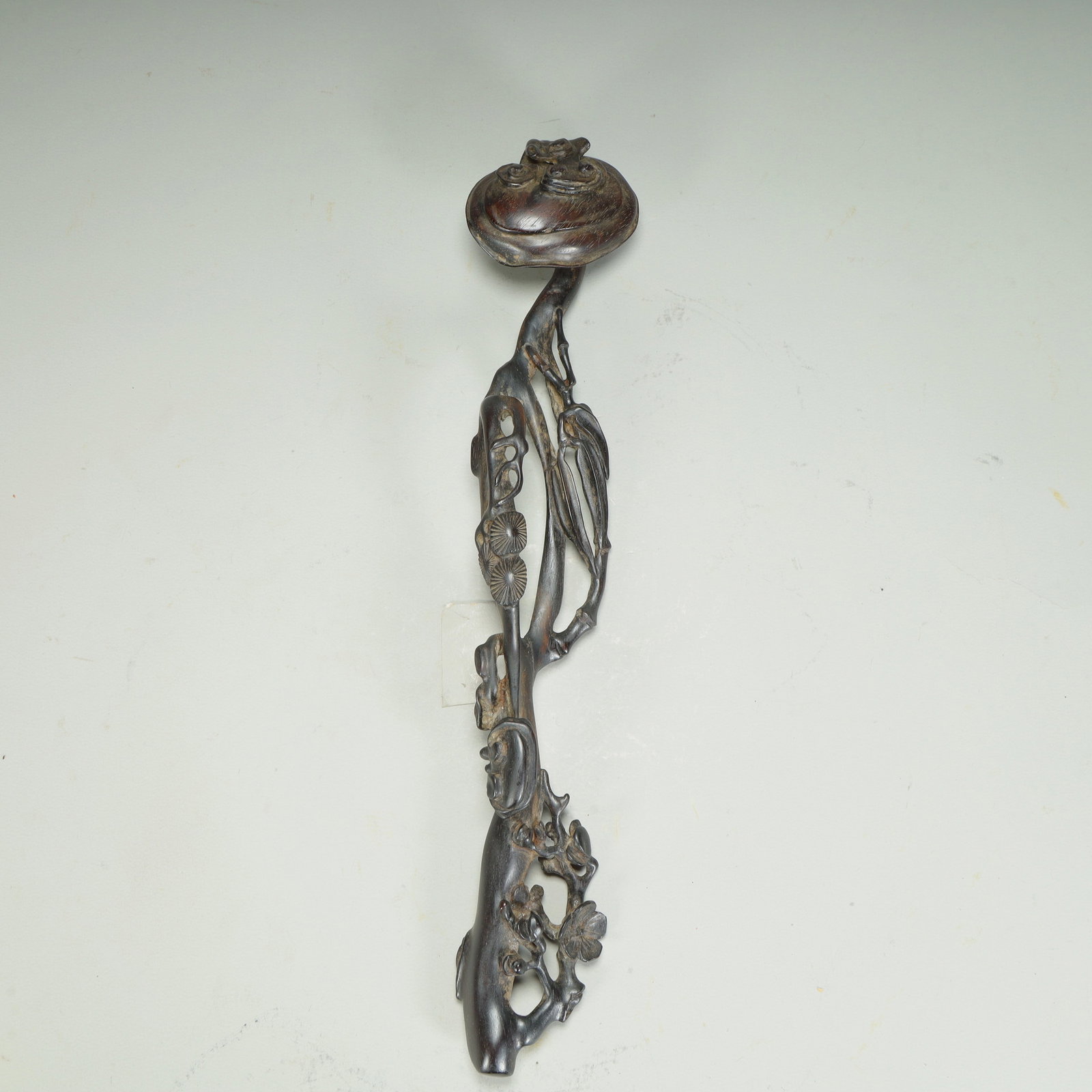 A piece of Qing Dynasty rosewood carving of the cold three friends pattern ruyi: Qing Dynasty rosewood carving three friends pattern ruyi SIZE: L:29cm W:5cm W:62g (The Dimensions Of All Batches Are Manually Measured.If You Need More Detailed Information, Please Contact Our
