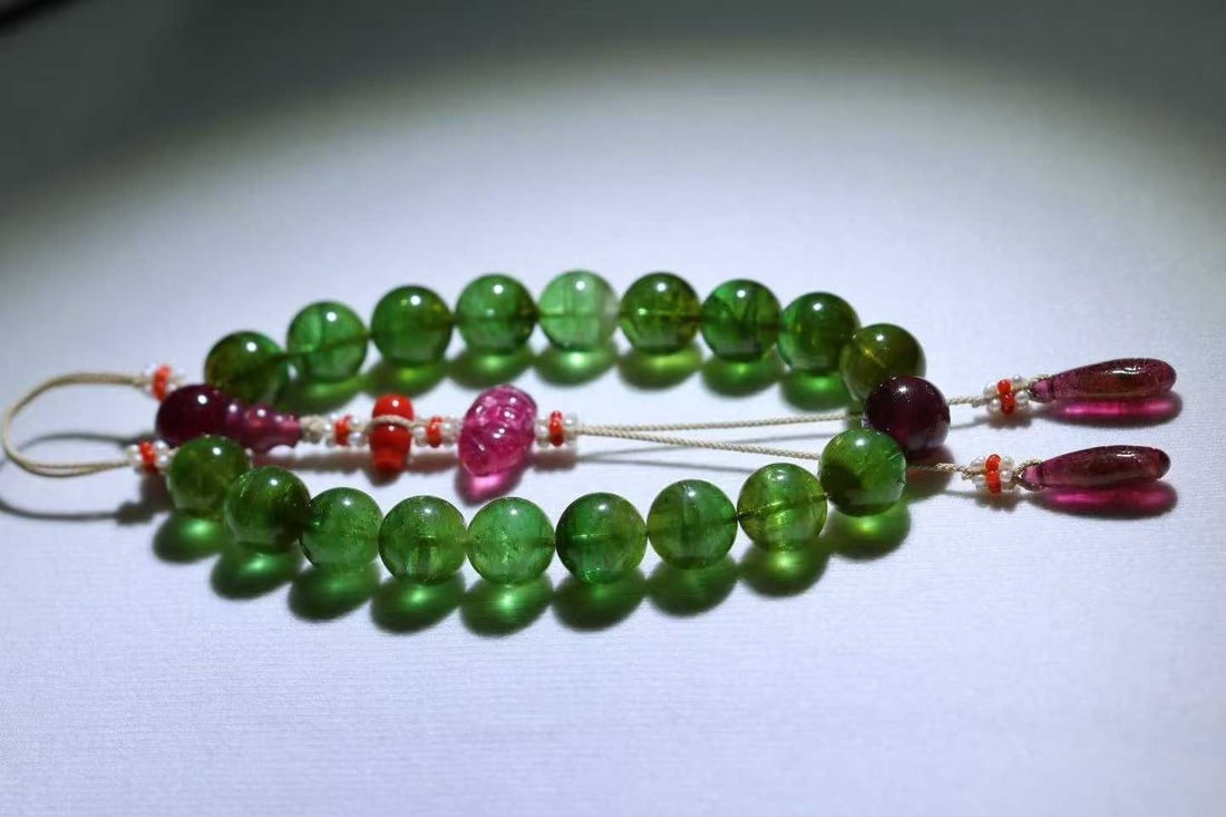 A piece of Qing Dynasty green tourmaline held by eighteen sons (1 of 6)