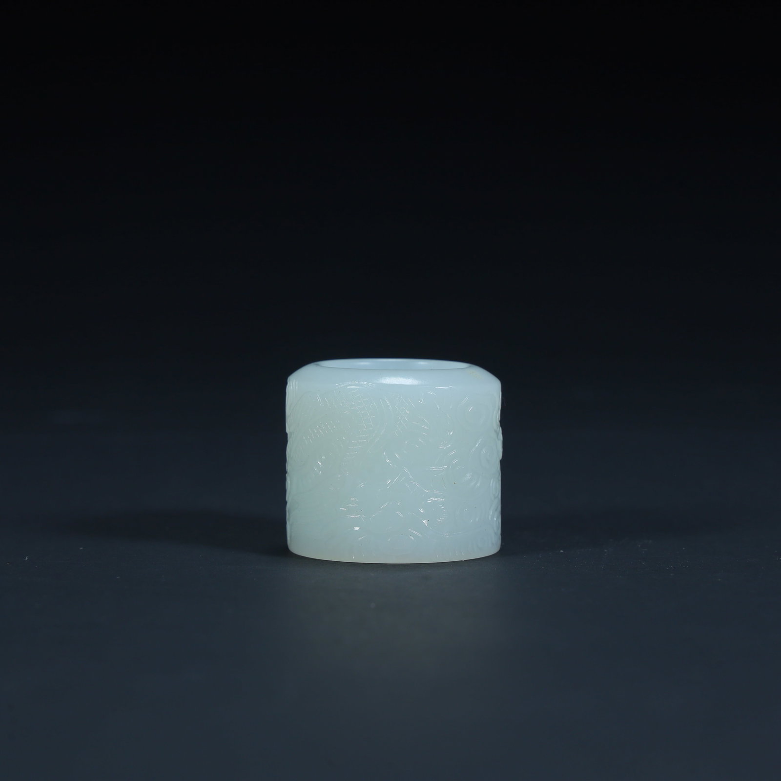 A Qing Dynasty Hetian jade bas-relief pattern finger: Qing Dynasty Hetian jade bas-relief pattern finger SIZE: H:3cm L:3cm W:3cm W:33.4g (The Dimensions Of All Batches Are Manually Measured.If You Need More Detailed Information, Please Contact Our Custom