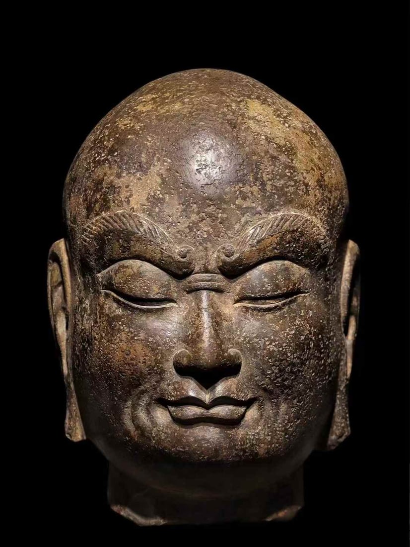 A Tang bluestone Arhat head: Tang Qingshi Arhat head SIZE: H: Degree 30cm (The Dimensions Of All Batches Are Manually Measured.If You Need More Detailed Information, Please Contact Our Customer Service Before Bidding.)