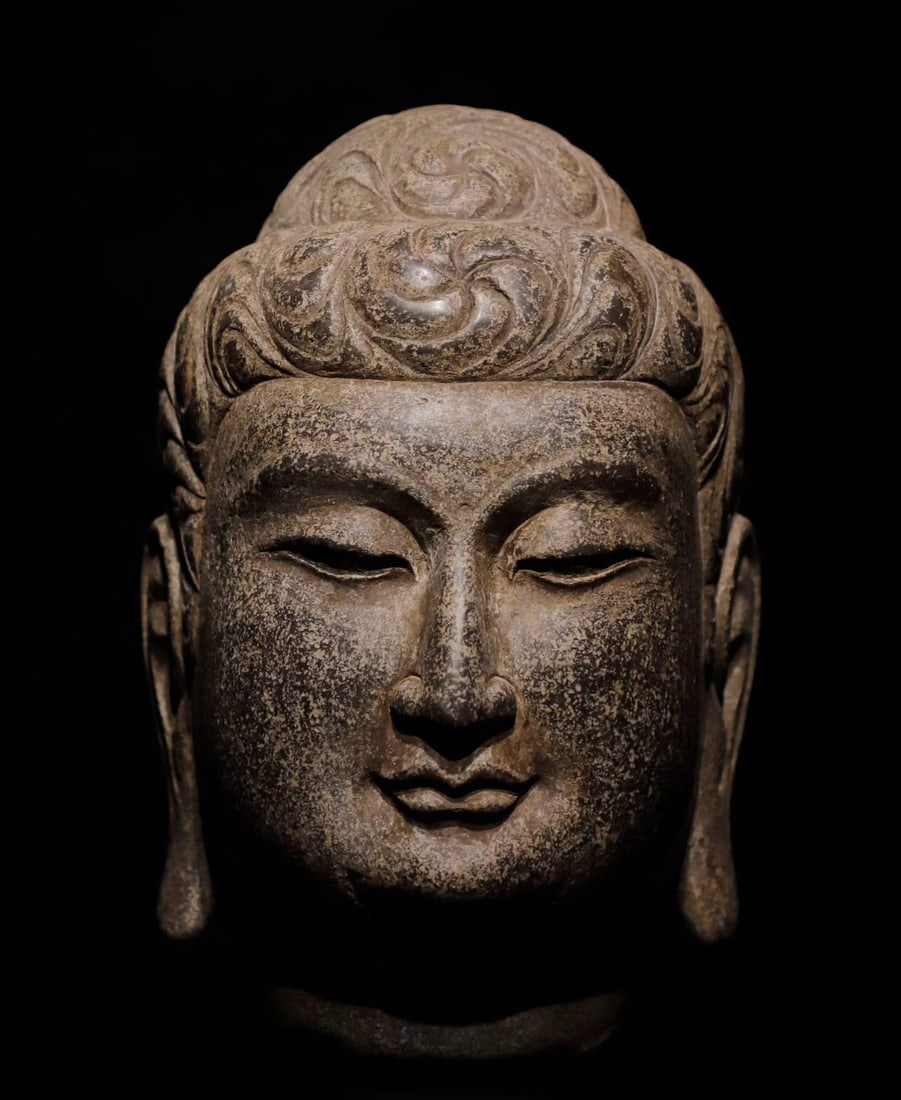A Tang Dynasty bluestone Buddha head: Tang Dynasty bluestone Buddha head SIZE: H:28cm (The Dimensions Of All Batches Are Manually Measured.If You Need More Detailed Information, Please Contact Our Customer Service Before Bidding.)