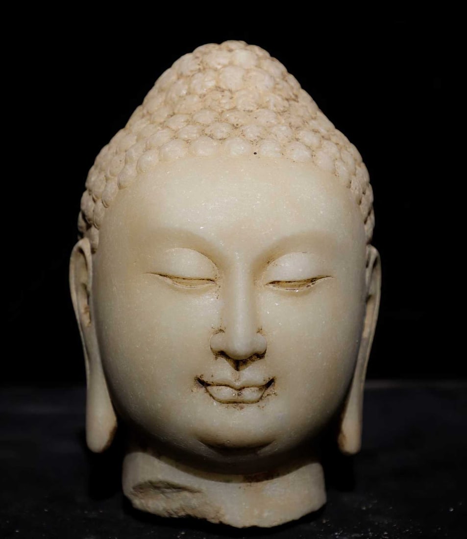 A piece of Northern Qi white jade Buddha head: Northern Qi white jade Buddha head SIZE: H:30cm (The Dimensions Of All Batches Are Manually Measured.If You Need More Detailed Information, Please Contact Our Customer Service Before Bidding.)