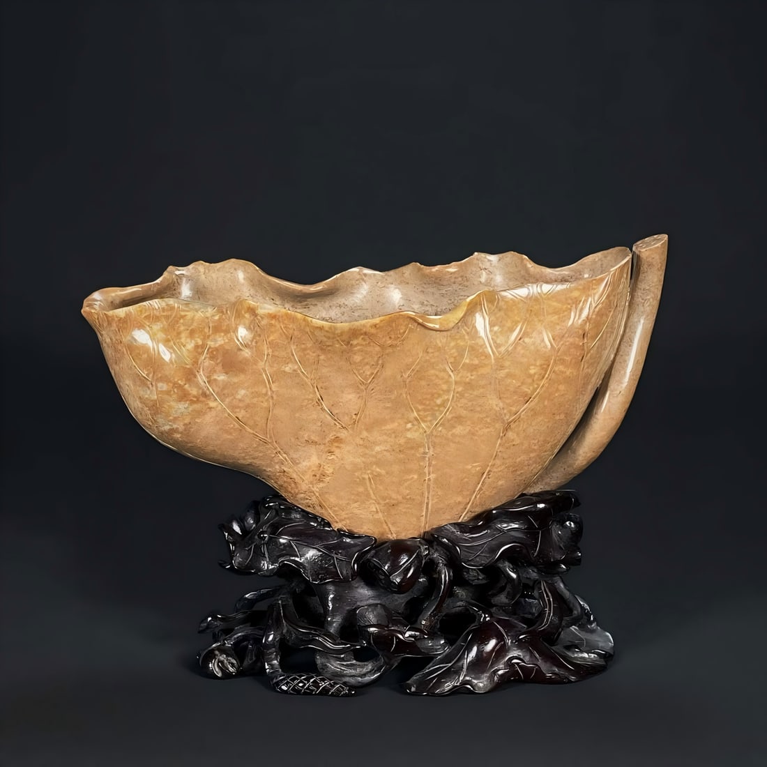 A Song Dynasty jade lotus leaf cup ornament: Song Dynasty jade lotus leaf cup ornament is made of lotus leaf washing seed material in the study, carved into the shape of a rolled lotus leaf, shaped like a dead straw and wrapped lotus leaf, in a 