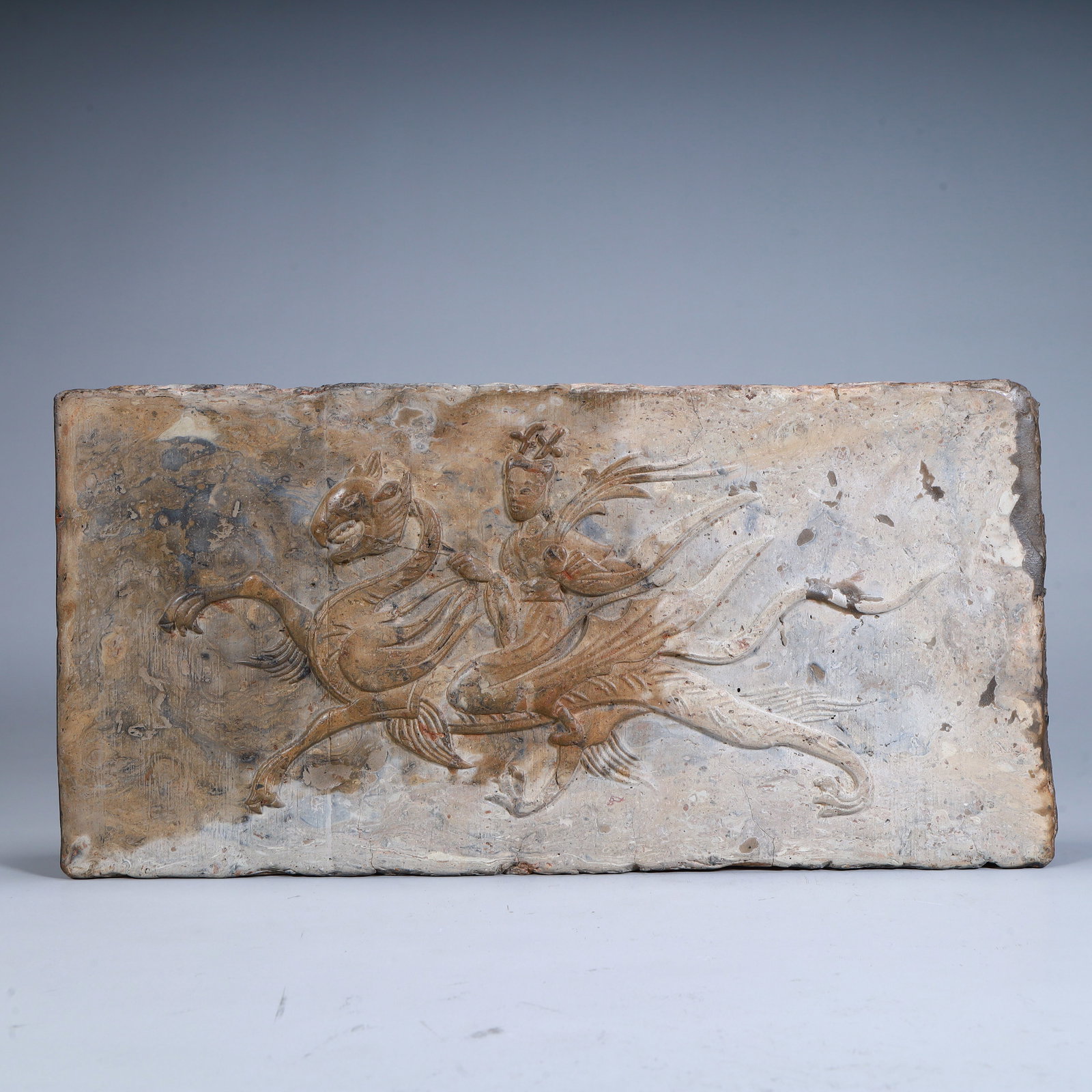 A portrait brick of a Southern Dynasty immortal riding a mythical beast (1 of 8)