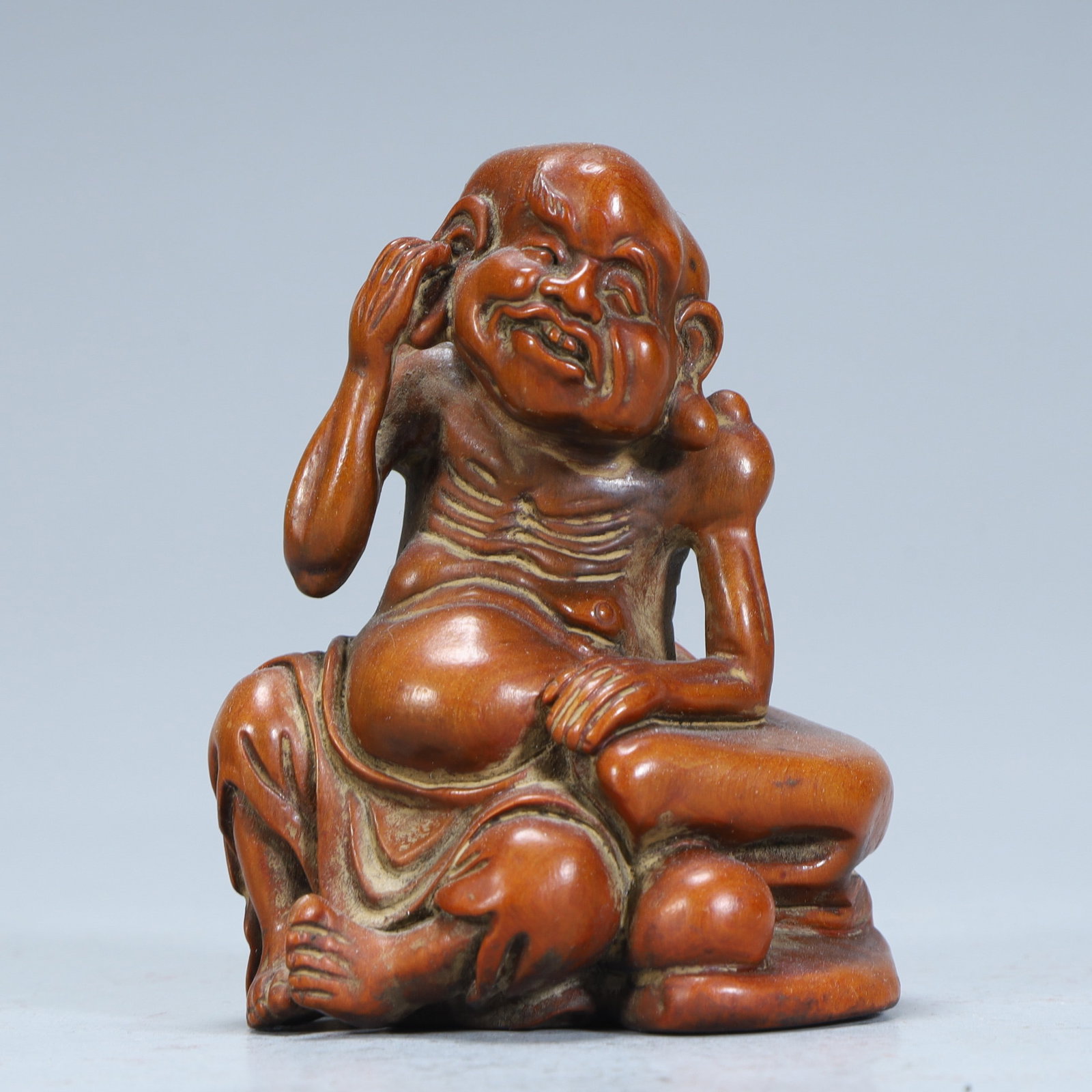 A Qing Dynasty boxwood carving ear-digging Arhat statue: Qing Dynasty boxwood carving ear-digging Arhat statue SIZE: H:7.5cm L:5.5cm W:5cm W:60g (The Dimensions Of All Batches Are Manually Measured.If You Need More Detailed Information, Please Contact Our C