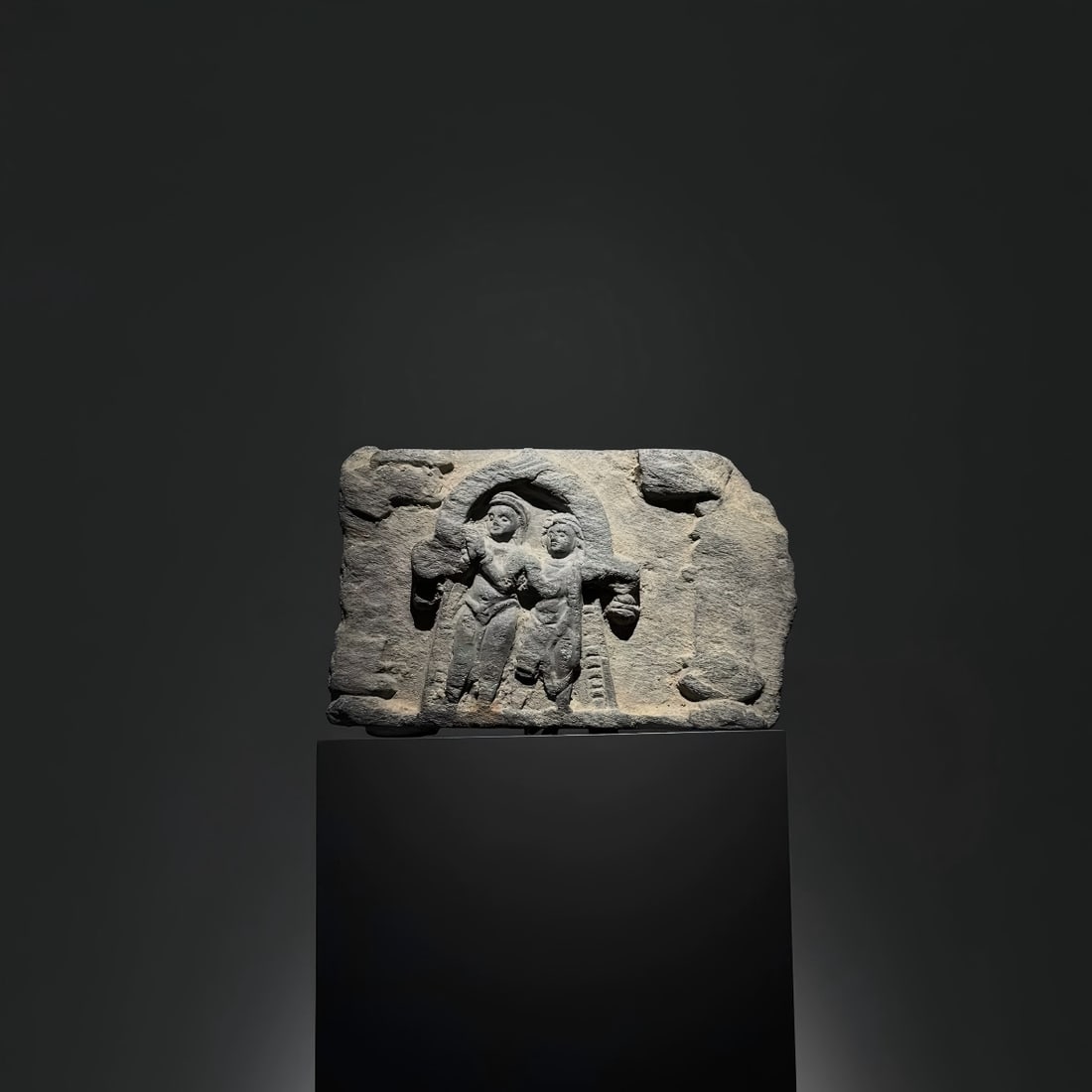 A Gandhara stone ornament from the 2nd-5th centuries AD depicting a man and a woman under an arch (1 of 5)