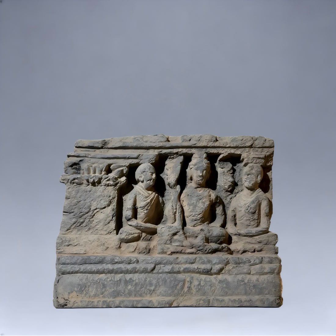 A Gandhara Buddha and his disciples from the 2nd to 5th centuries AD think under the tree (1 of 4)
