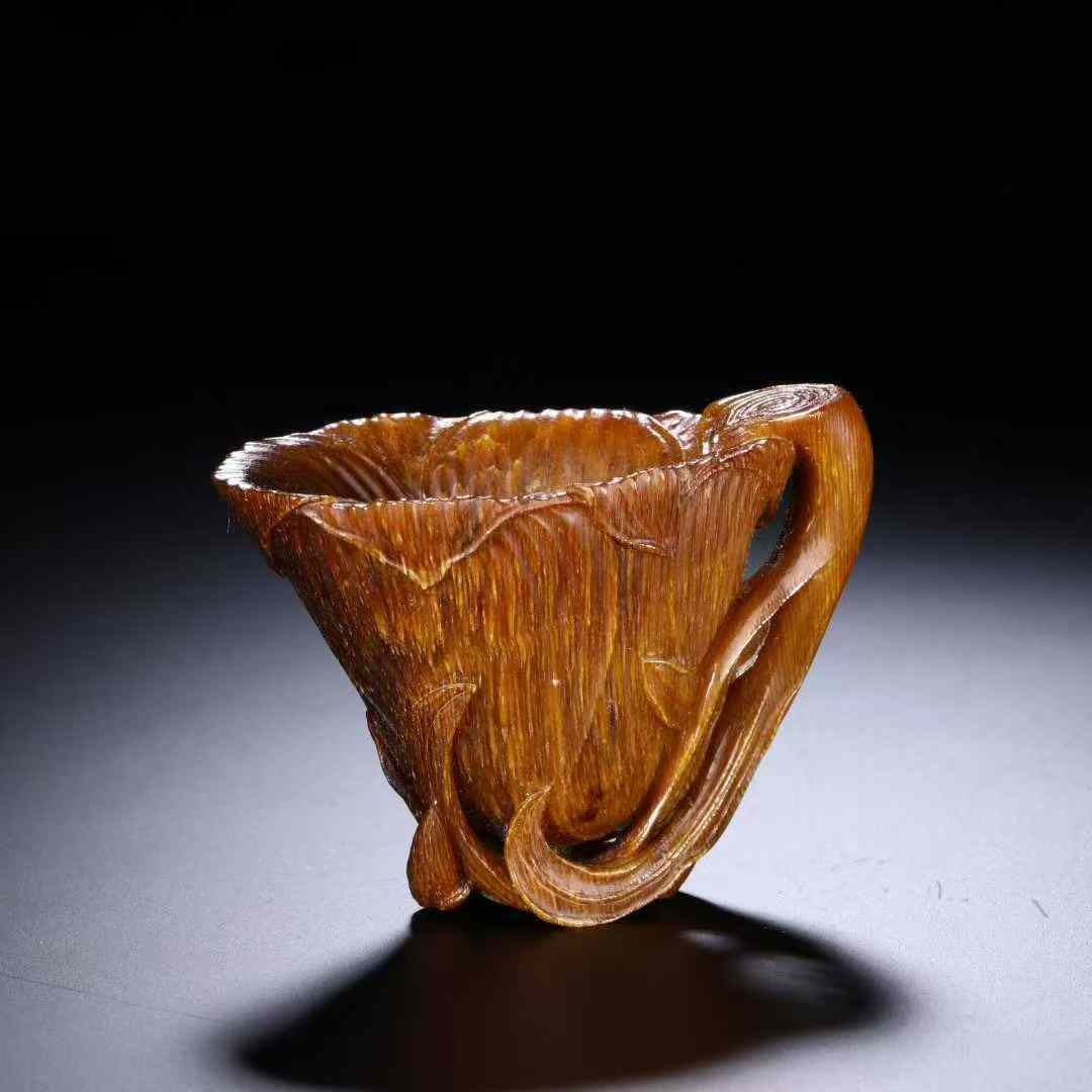 A Qing Dynasty horn-carved magnolia cup: Qing Dynasty corner carved magnolia flower cup SIZE: 43x62x38cm W:31g (The Dimensions Of All Batches Are Manually Measured.If You Need More Detailed Information, Please Contact Our Customer Service Be