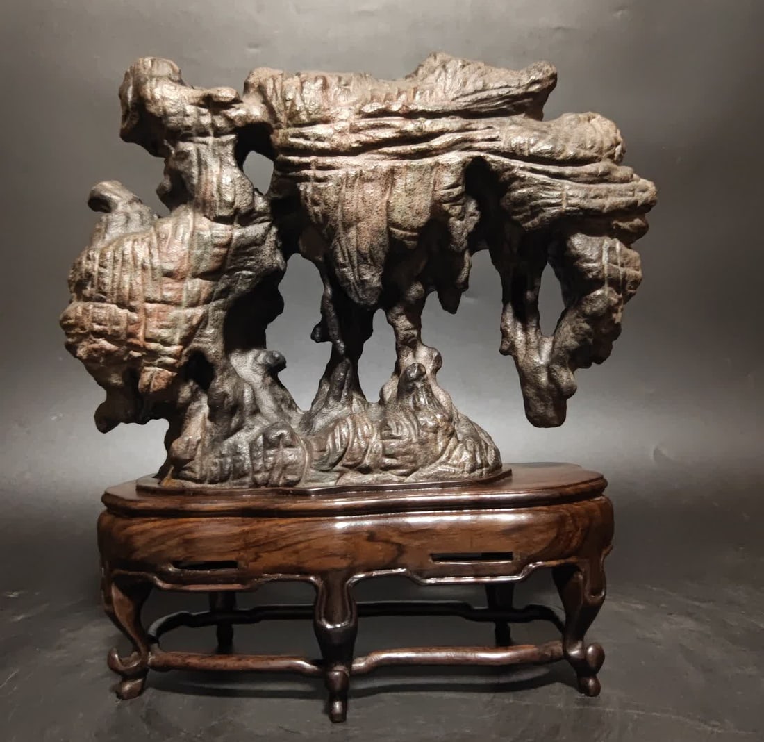 A Qing Dynasty Lingbi stone study ornament: Qing Dynasty Lingbi stone ornament This Lingbi stone has a texture like a heavenly book etched by the years, and the hole is like a hallway carved by heaven and earth and placed on the desk SIZE: With