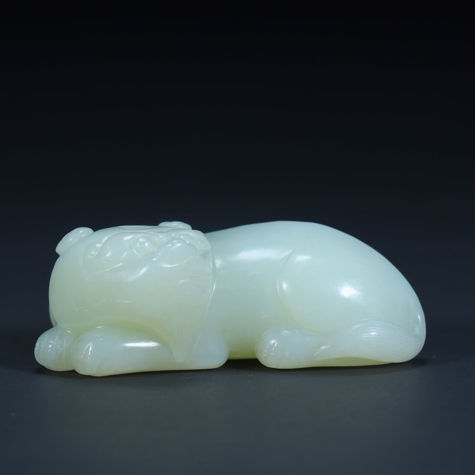 A Qing Dynasty Hetian jade beast ornament: Qing Dynasty Hetian jade auspicious beast ornament SIZE: H:3cm L:8cm W:4.2cm W:143.5g (The Dimensions Of All Batches Are Manually Measured.If You Need More Detailed Information, Please Contact Our Cus