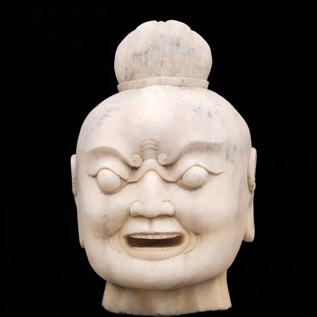 A Qing Dynasty stone carved wrestler head (1 of 9)