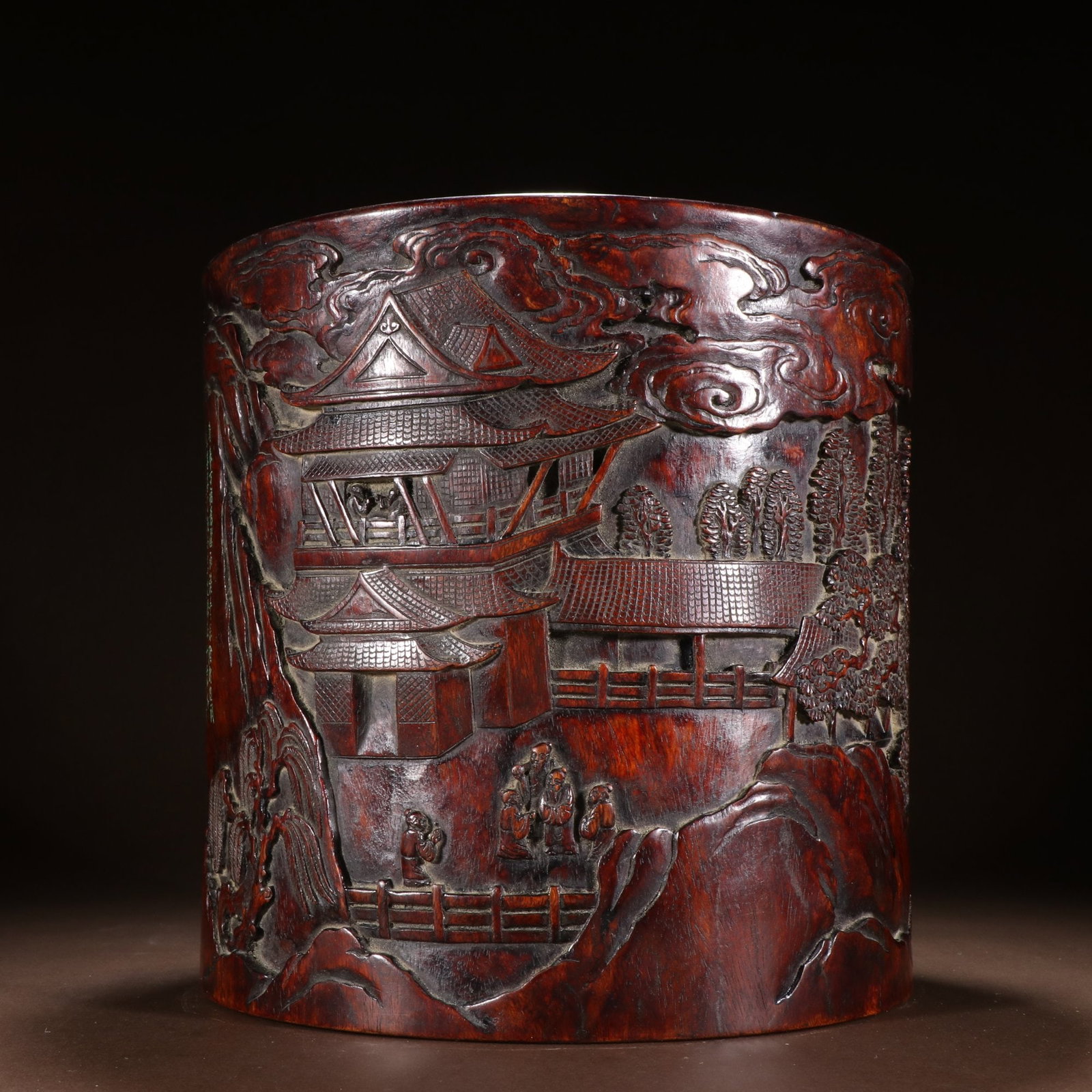 A Qing Dynasty rosewood landscape character story pen holder: Qing Dynasty rosewood landscape character story pen holder This Huanghuali pen holder carved the fairy mountain pavilion The carving is deep, the layers are distinct, the pen holder is extremely thick