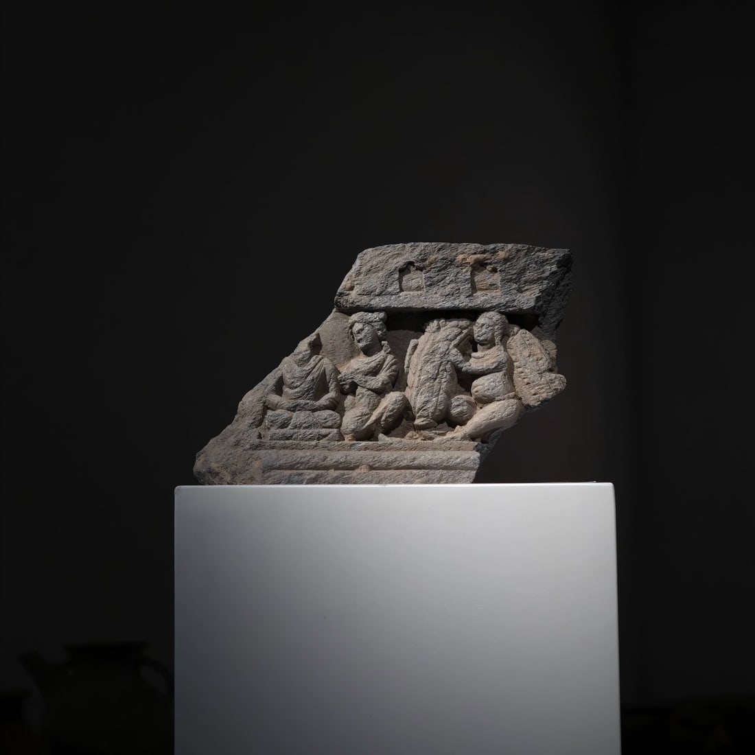 A Gandhara stone carving carrying a wreath boy from the 2nd to 5th centuries AD: Gandhara stone carving carrying a wreath boy SIZE: W:25cm H:18cm (The Dimensions Of All Batches Are Manually Measured.If You Need More Detailed Information, Please Contact Our Customer Service Before 