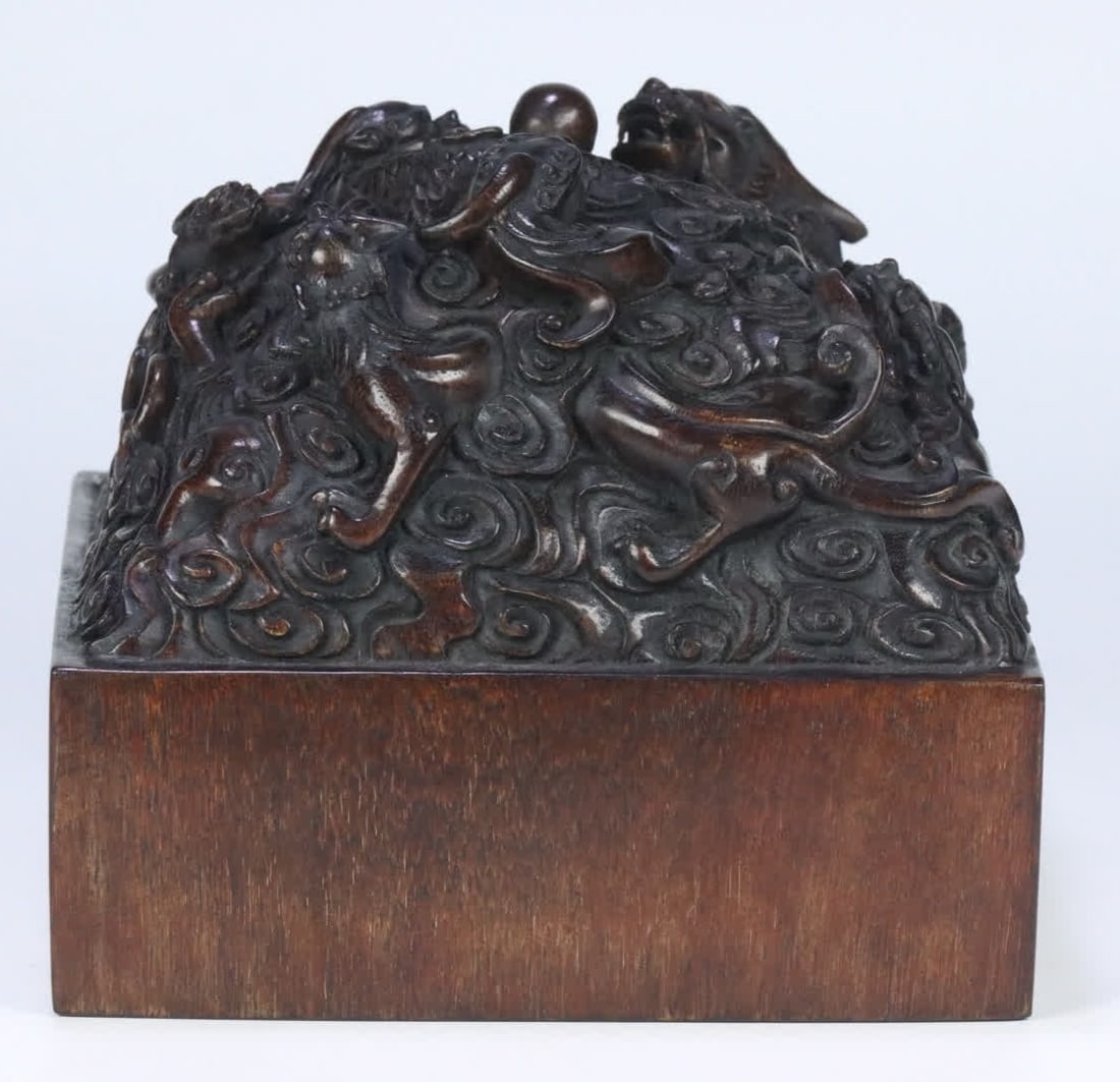 A Qing Jiaqing Imperial Seal with Old Agarwood Dragon Nine Sons Pattern, Treasured by the Qing (1 of 10)