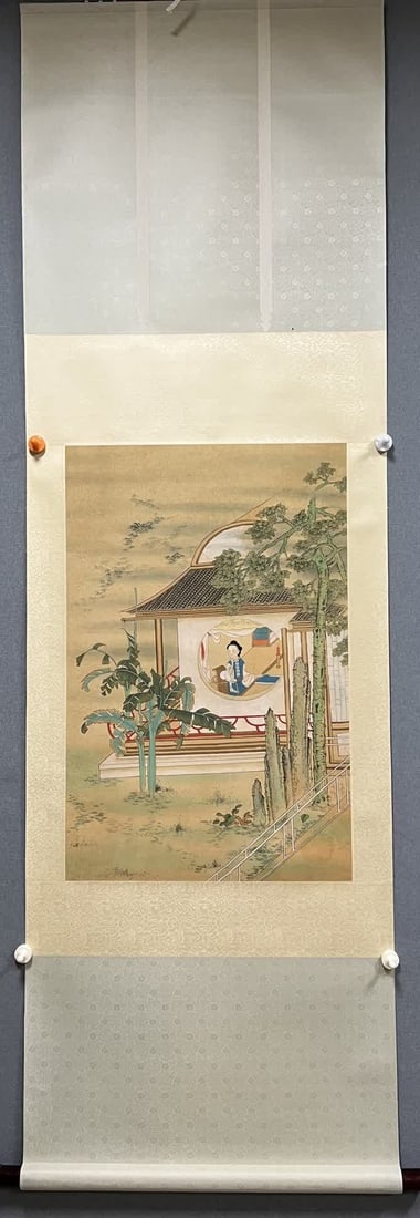 A small portrait of a lady standing on a scroll (1 of 7)