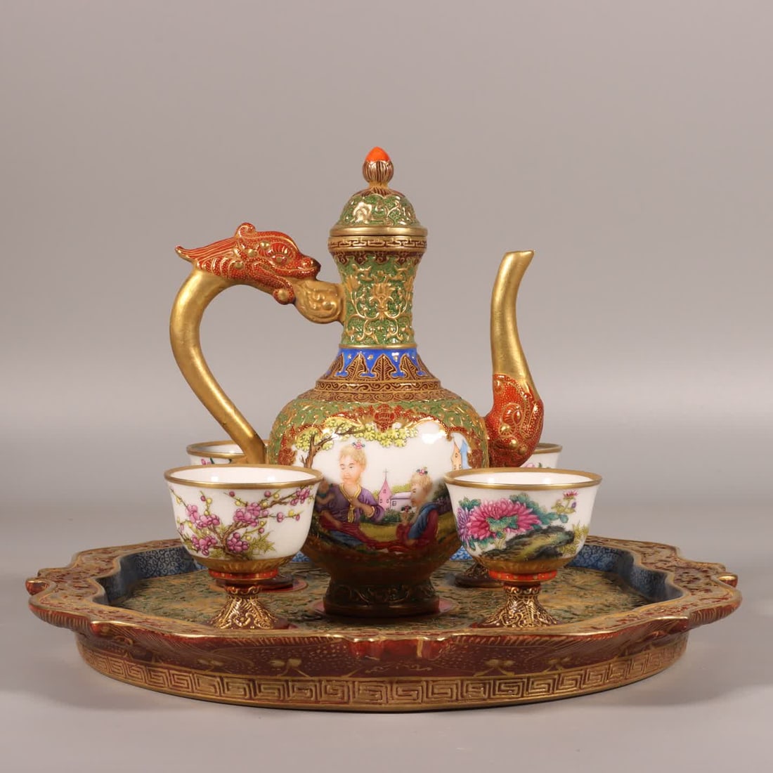 A set of Qing dynasty Qianlong period enamel carved green background with gilded Western figure wine: Qing Dynasty Qianlong period enamel carving, green-ground gilded Western figure wine pot SIZE: Pot H: 17cm, Stomach diameter 8cm, Cup H: 5.2cm, Mouth D: 5.2cm, Plate H: 2.6cm, Stomach diameter 25cm