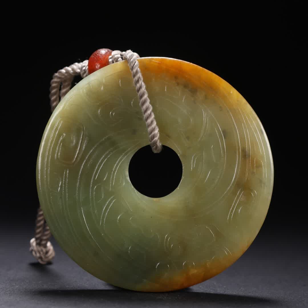 A piece of ancient jade bi (1 of 9)