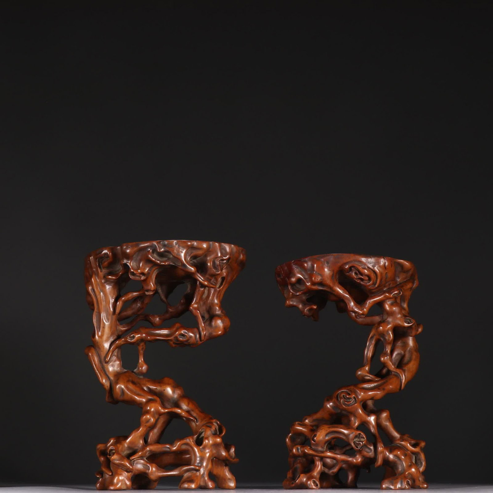 One pair of Qing dynasty boxwood hollow root-shaped bases: Qing Dynasty: A pair of boxwood hollow root-shaped bases SIZE: H:14.2cm W:10.2cm Single W:140g (The Dimensions Of All Batches Are Manually Measured.If You Need More Detailed Information, Please Contac