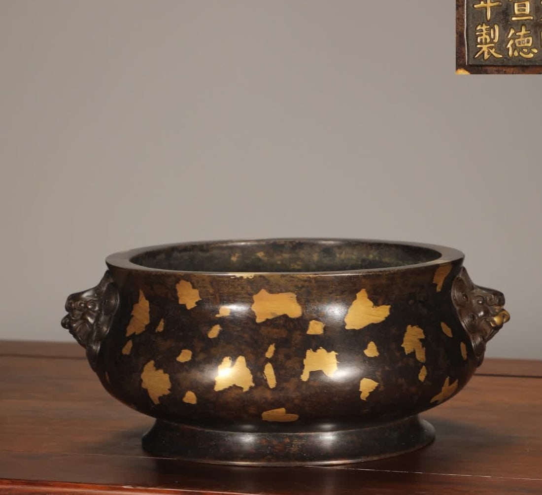 A Ming Dynasty bronze-inlaid gold-inlaid lion-headed burner with gold fittings (1 of 9)