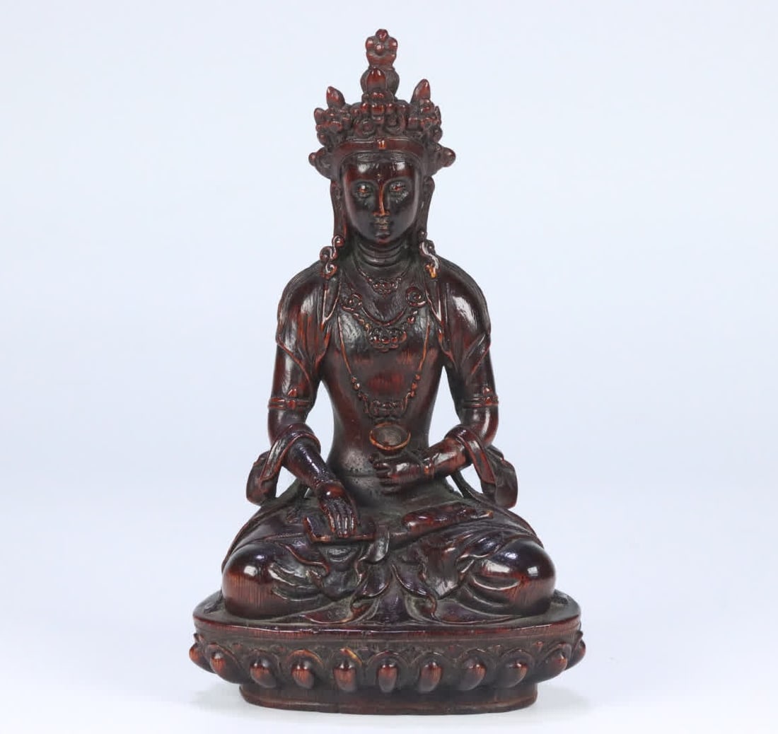 A seated statue of the Longevity Buddha of old agarwood from the Qing Dynasty (1 of 9)