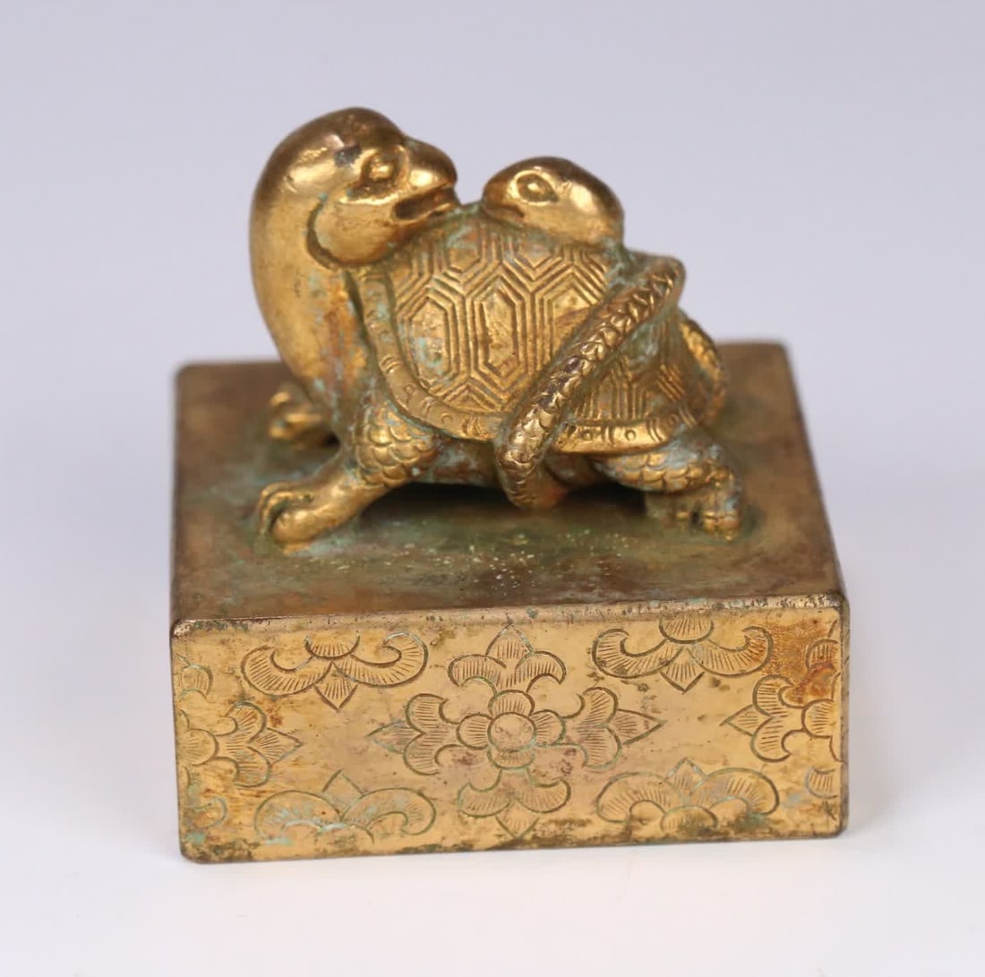 One Han Dynasty bronze gilt seal with a black tortoise knob: Han dynasty bronze gilt black tortoise knob seal SIZE: 5.3x5.2x5.3cm W:601g (The Dimensions Of All Batches Are Manually Measured.If You Need More Detailed Information, Please Contact Our Customer Serv