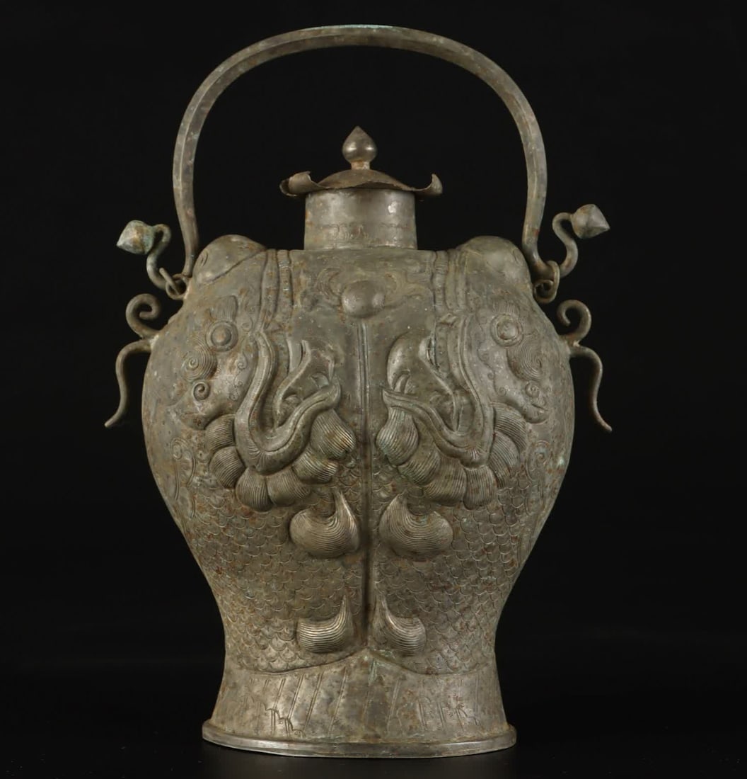 A Tang Dynasty Double Fish Teapot: Tang Dynasty Double Fish Holding Teapot SIZE: W:389g H:22cm W:6.5cm (The Dimensions Of All Batches Are Manually Measured.If You Need More Detailed Information, Please Contact Our Customer Service Befo