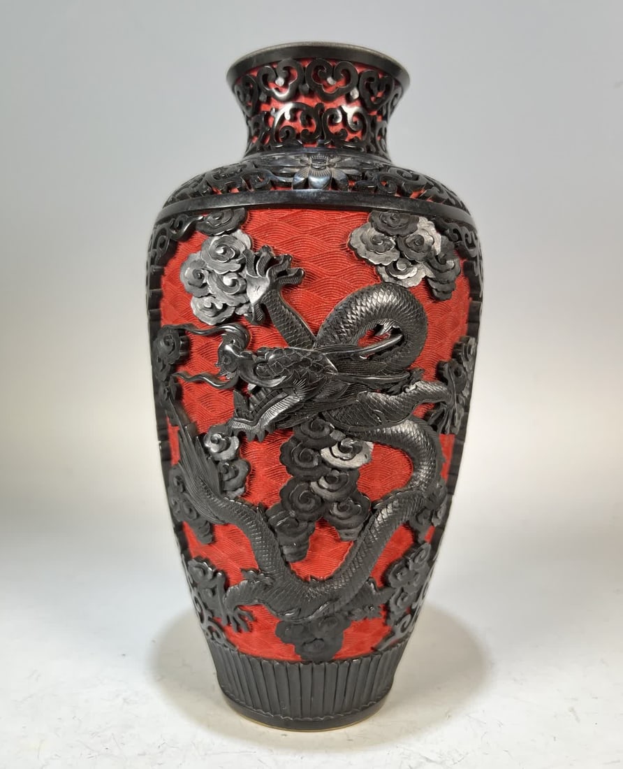 A late Qing dynasty bronze-bodied red and black auspicious dragon, cloud, and sea pattern: Late Qing dynasty bronze-bodied red and black carved auspicious dragon, cloud, and sea pattern appreciation vase SIZE: H:23cm Abdominal diameter 10.5cm (The Dimensions Of All Batches Are Manually Meas