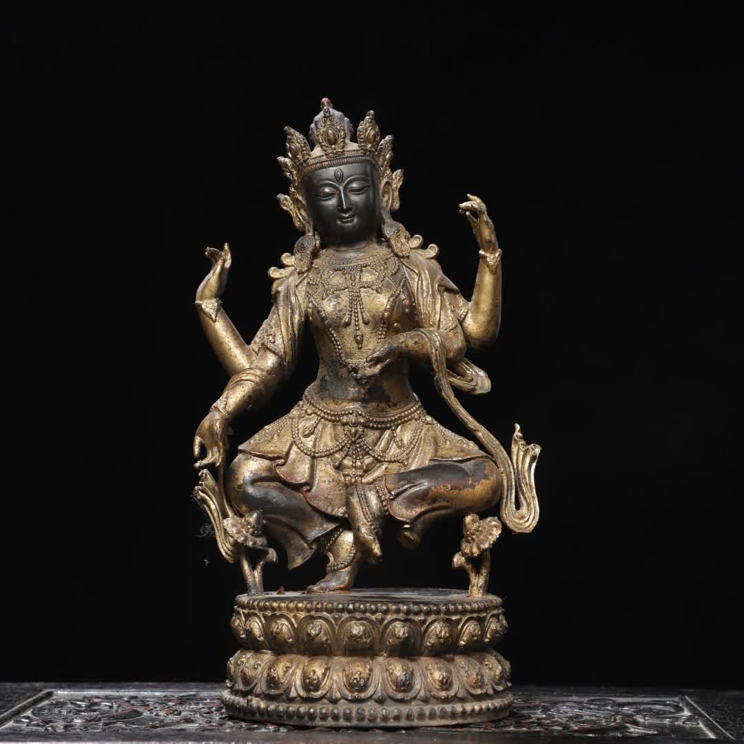 A Qing Dynasty bronze rubbing four-armed Tara Buddha statue (1 of 9)