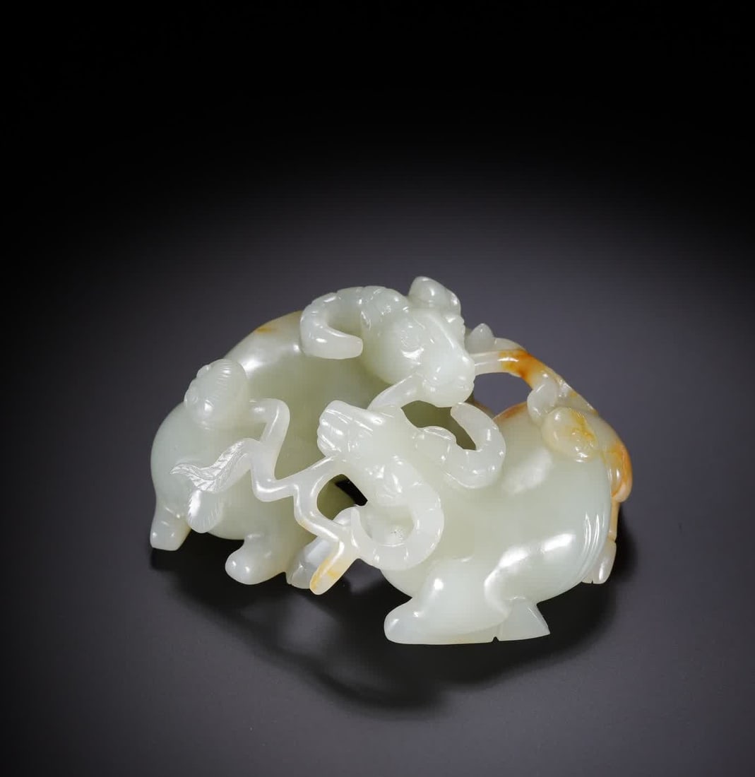 A Qing Dynasty Hetian jade goat holding a lingzhi mushroom ornament (1 of 10)