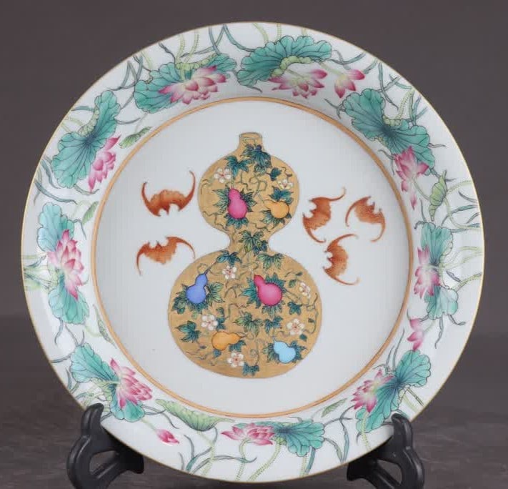 A Qing Yongzheng period famille rose lotus five-blessing plate (1 of 9)