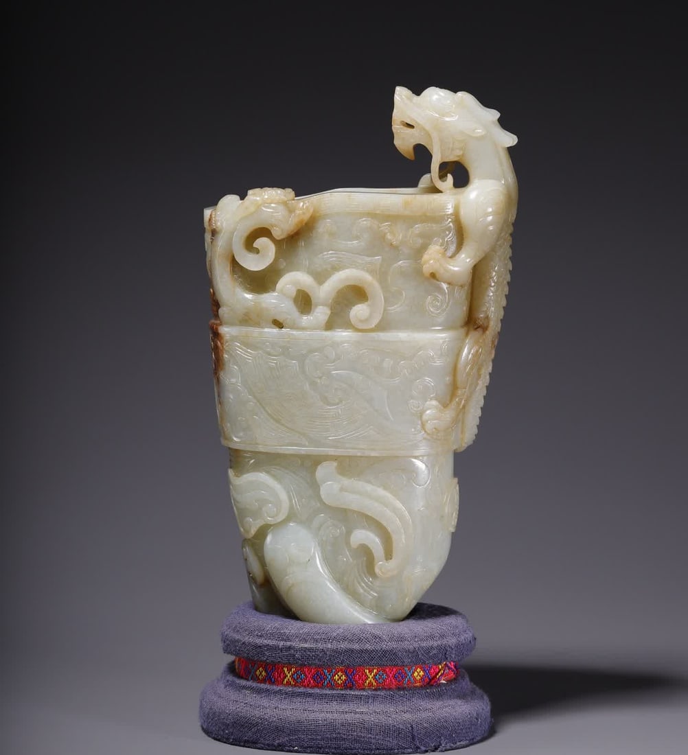 A Qing Dynasty Hetian jade dragon-patterned corner cup: Qing Dynasty Hetian jade dragon-patterned corner cup SIZE: 20x11.2x5.5cm W:1093.7g (The Dimensions Of All Batches Are Manually Measured.If You Need More Detailed Information, Please Contact Our Custom