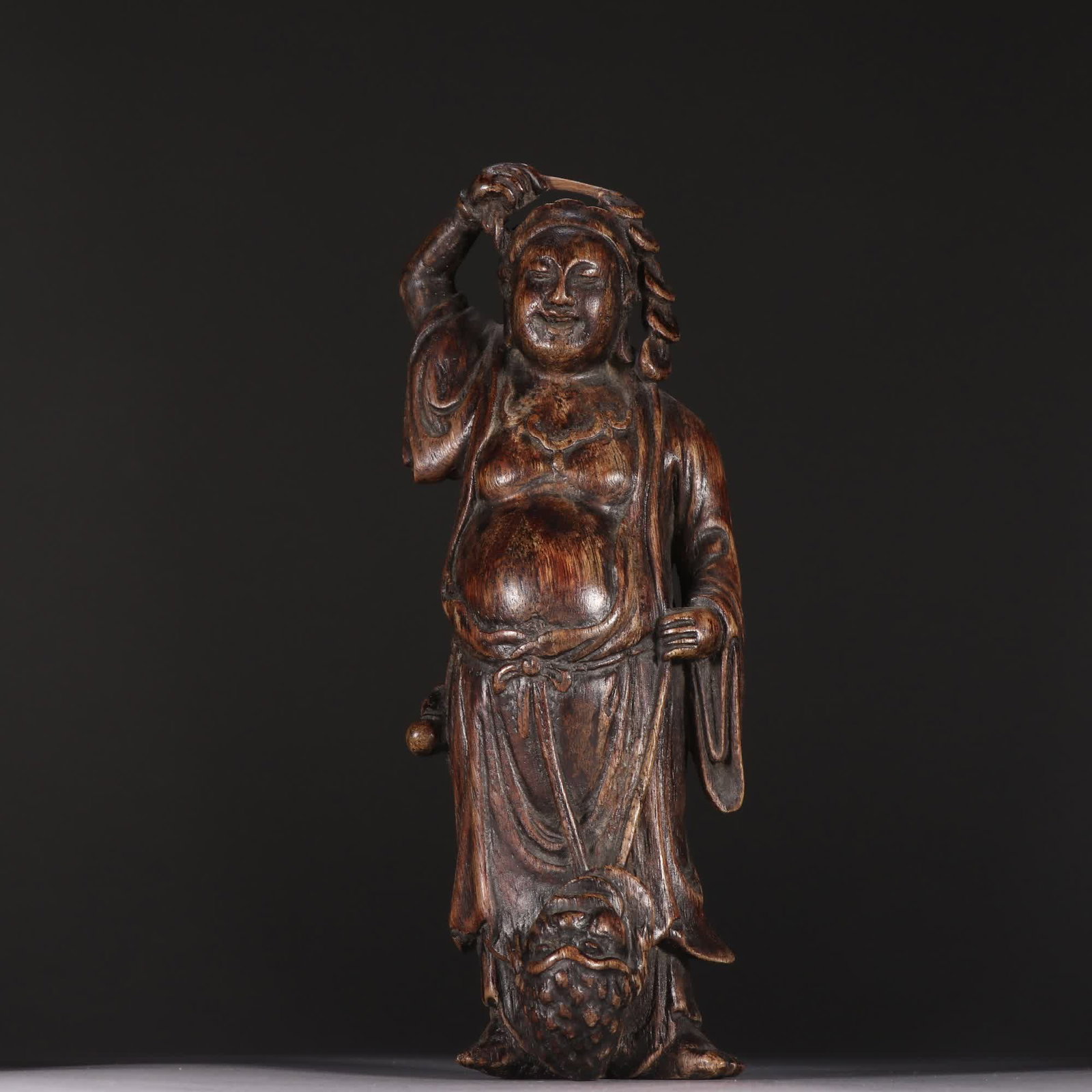 A Qing dynasty agarwood liuhai playing with a golden toad sculpture: Qing Dynasty: Chenxiang Liu Hai Playing with the Golden Toad Statue SIZE: H:21cm W:7.5cm W:118.4g (The Dimensions Of All Batches Are Manually Measured.If You Need More Detailed Information, Please Con