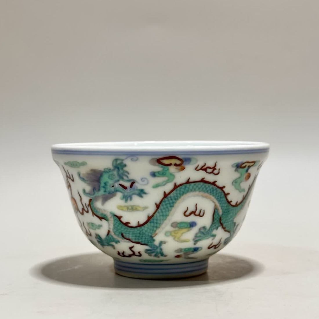 One bowl made during the Yongzheng period of the Qing Dynasty with blue-and-white doucai dragon and: A blue-and-white doucai bowl with dragon and phoenix patterns made during the Yongzheng period of the Qing Dynasty SIZE: H:5.4cm Mouth D:8.8cm Bottom 4cm (The Dimensions Of All Batches Are Manually Me