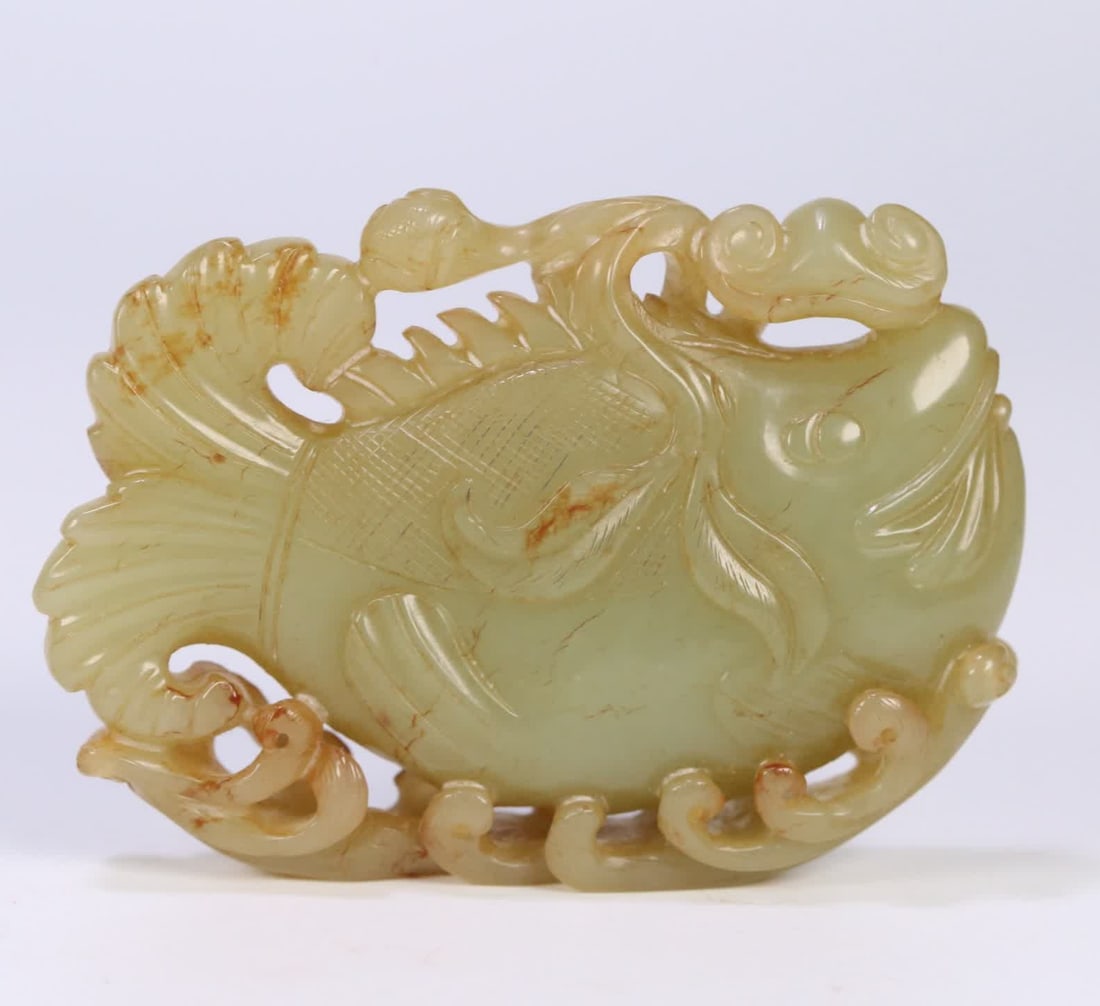 A fish ornament from the Qing Dynasty Hetian Huangyulian with a lotus: Qing Dynasty Hetian Huangyulian Lotus Fish Ornament SIZE: 8.3x5.7x1.8cm W:109.8g (The Dimensions Of All Batches Are Manually Measured.If You Need More Detailed Information, Please Contact Our Customer