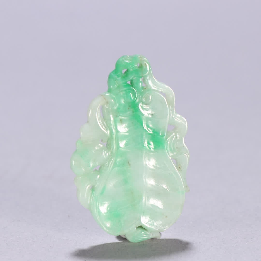 A Qing dynasty jadeite fortune pendant (1 of 9)