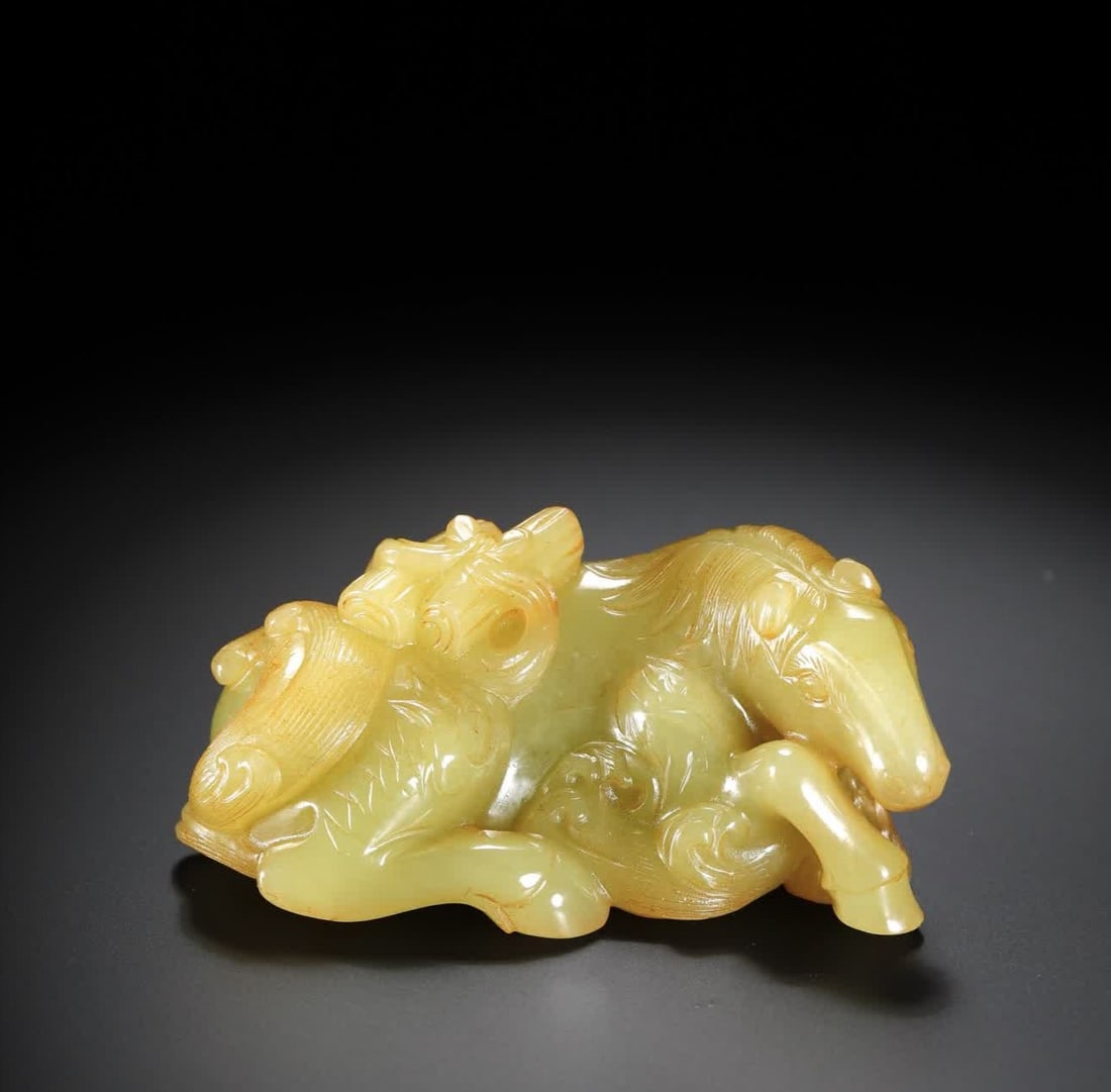 A Qing Dynasty Hetian yellow jade reclining horse: Qing Dynasty Hetian yellow jade reclining horse SIZE: 6.8x4.7x3.0cm W:114.5g (The Dimensions Of All Batches Are Manually Measured.If You Need More Detailed Information, Please Contact Our Customer Ser