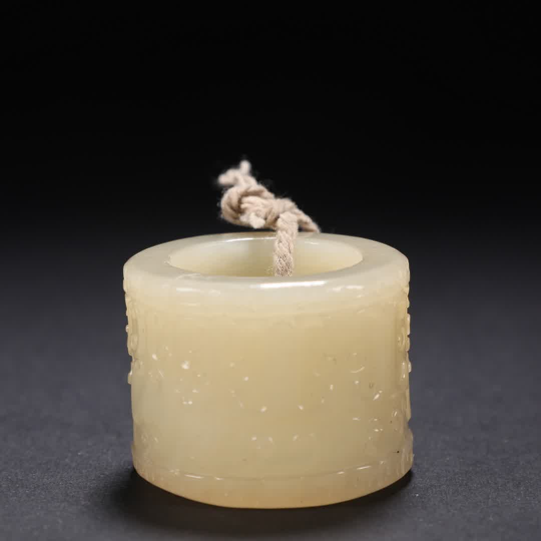 A Qing Dynasty Hetian jade thumb ring: Qing Dynasty Hetian jade thumb ring SIZE: Inner diameter 2.25cm, H: 2.6cm, W: 36g (The Dimensions Of All Batches Are Manually Measured.If You Need More Detailed Information, Please Contact Our Custome