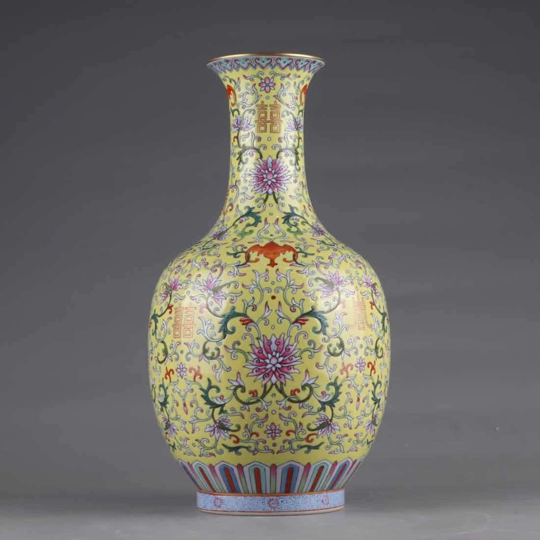 A Qing Qianlong period yellow ground famille rose lotus vase with gilded entwined lotus branches (1 of 9)