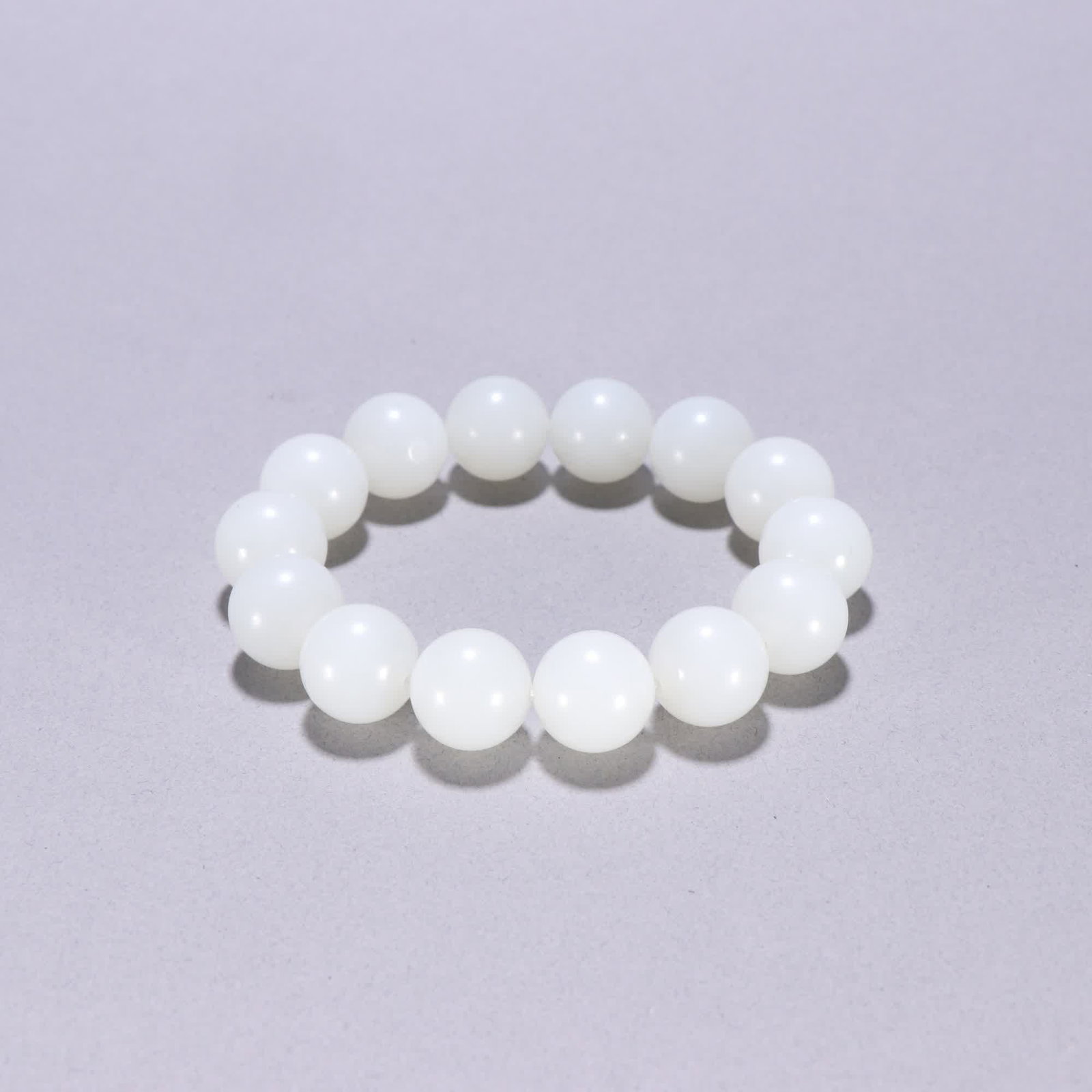 A Qing Hetian jade bracelet: Qing Hetian jade bracelet SIZE: Bead diameter 1.4cm W: 67.6g (The Dimensions Of All Batches Are Manually Measured.If You Need More Detailed Information, Please Contact Our Customer Service Before Bidd