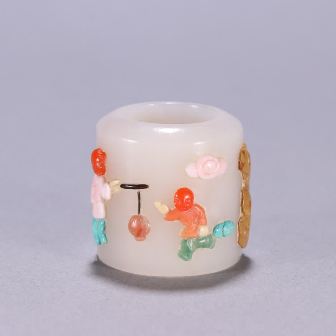 A Qing Dynasty Hetian jade ring inlaid with a hundred treasures child playing with plum blossom (1 of 9)